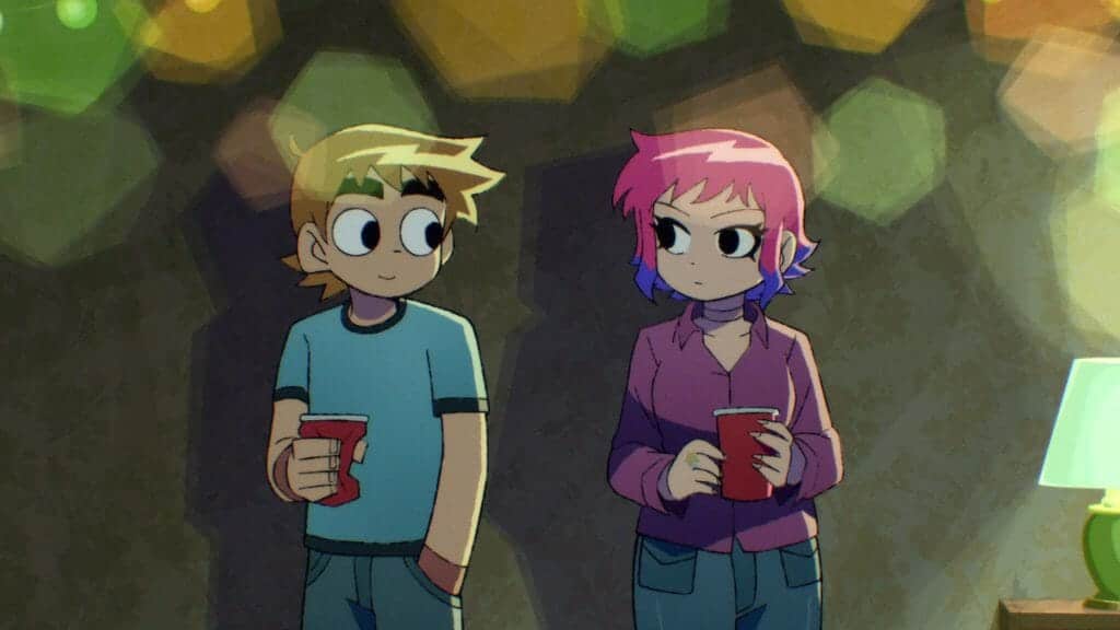 Scott Pilgrim standing next to a pink haired Ramona Flowers, both are holding Red Solo Cups.