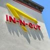 In-N-Out logo with red lettering and yellow arrow