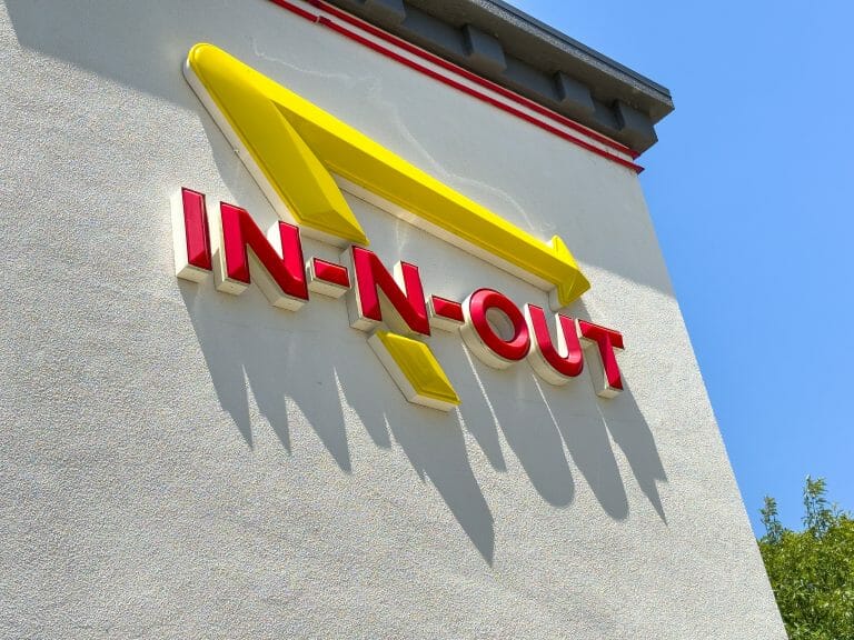 In-N-Out logo with red lettering and yellow arrow