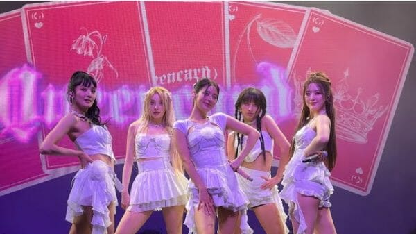 (G)I-DLE posing on stage for their song "Queencard."