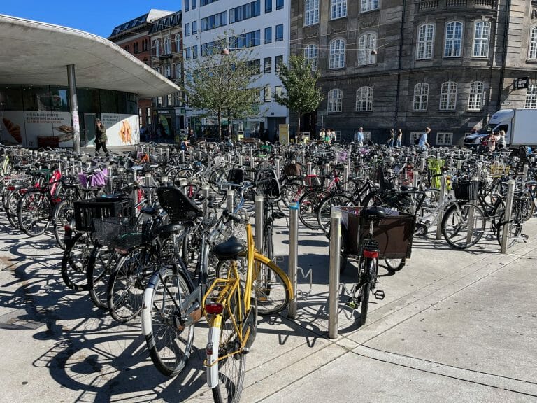 Rows of bikes parked in a bike locking facility outside one of Copenhagen's stations. 