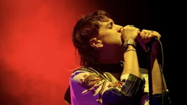 Julian Casablancas, lead vocalist of The Strokes, performing a show.