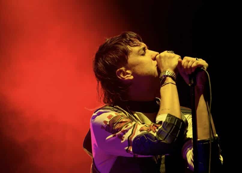 Julian Casablancas, lead vocalist of The Strokes, performing a show.