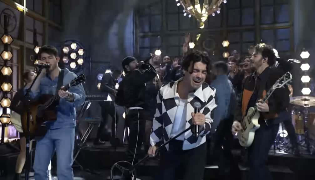 The Jonas Brothers on stage with Jon Bellion