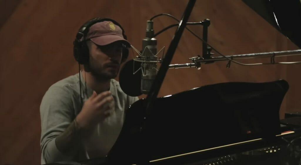 Music producer Jon Bellion recording in the studio.