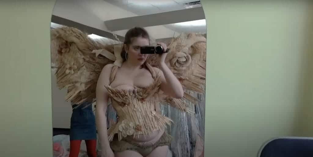 Fashion designer Michaela Stark poses in old angel wings for inspiration. 