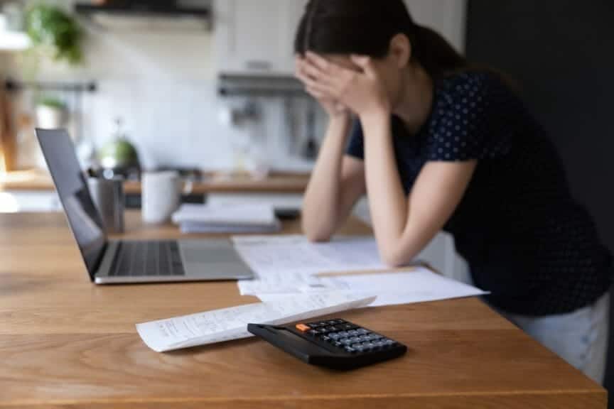 An image of a young person concerned about their finances.