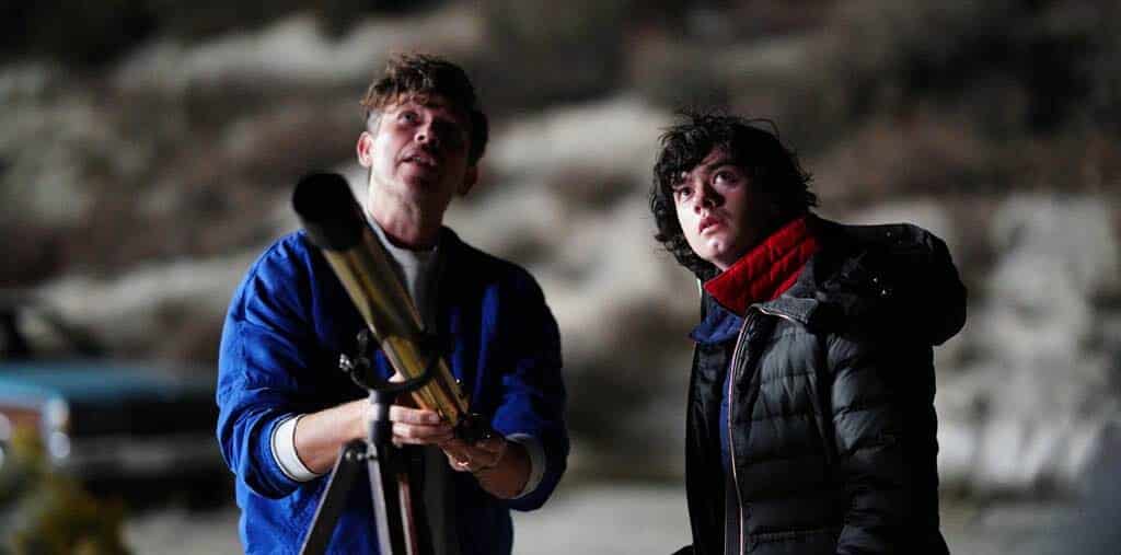 Image of Dante's dad, Sam Quintana, and Date looking at the sky with a telescope in front of them.