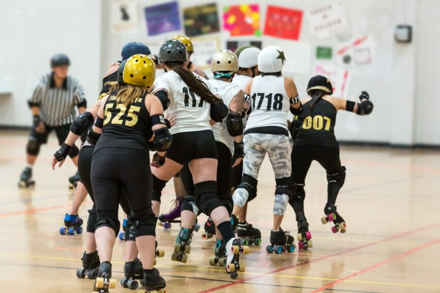 Roller derby players compete against each other. Photo Credits: Shutterstock/Elizabeth A. Cummings