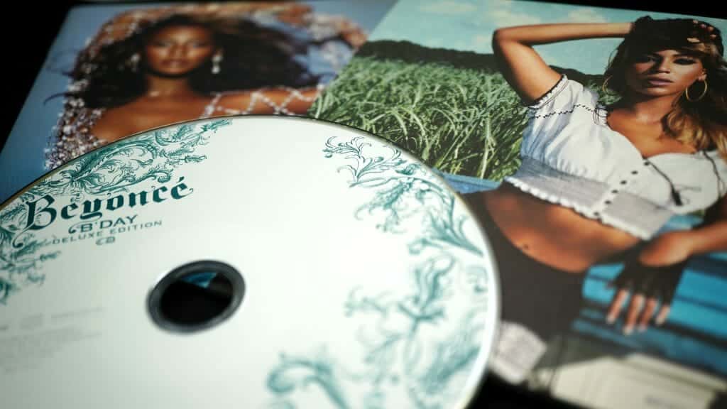 A photo of a Beyoncé CD and pictures of Beyoncé.