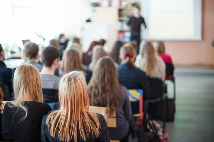 Students learning in a college classroom.
