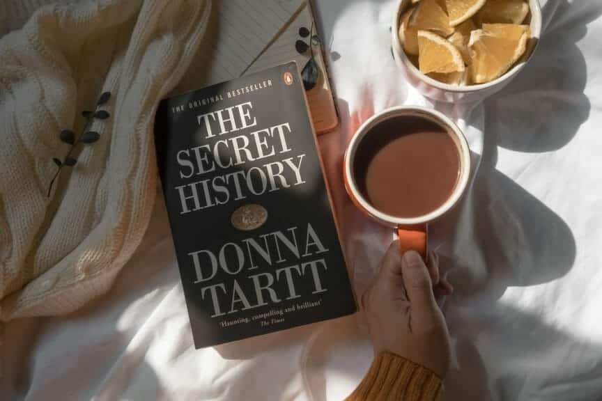 The Secret History with a coffee mug