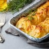 Potato au gratin with rosemary and cutlery