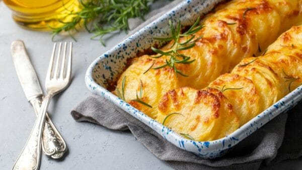 Potato au gratin with rosemary and cutlery