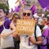 People protesting with a Jenni Contigo sign in Madrid, Spain.
