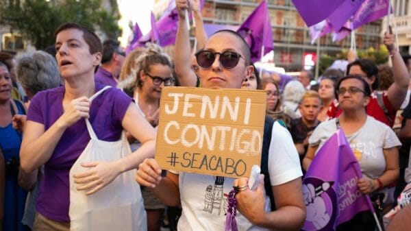 People protesting with a Jenni Contigo sign in Madrid, Spain.