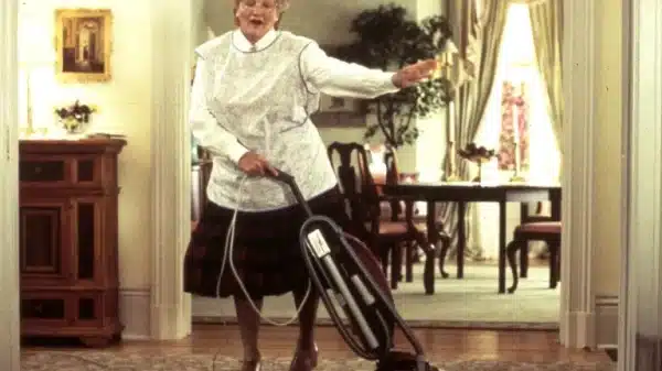 Mrs. Doubtfire hoovering the living room.