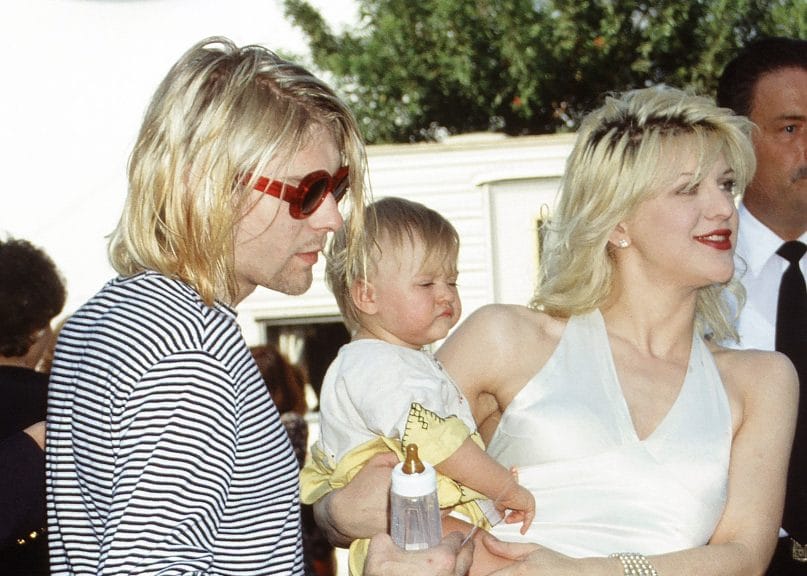 Kurt Cobain and Courtney Love with their infant daughter.