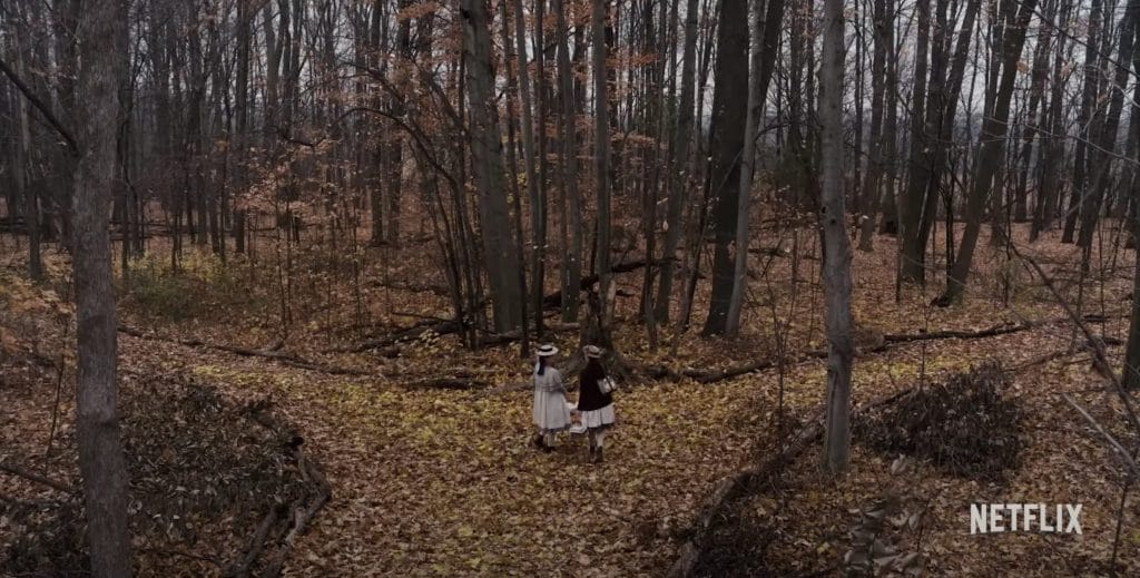 Image of Anne and Diana in the forest, both girls at the center. 