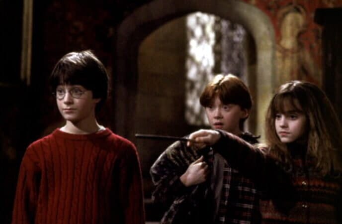 Image of Harry Potter actors Daniel Radcliff, Rupert Grint, and Emma Watson in the first film. 