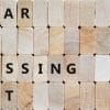 Wooden blocks spell our "fear of missing out," with the first letter of each word red.