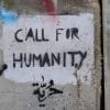 Call for Humanity written on a wall.