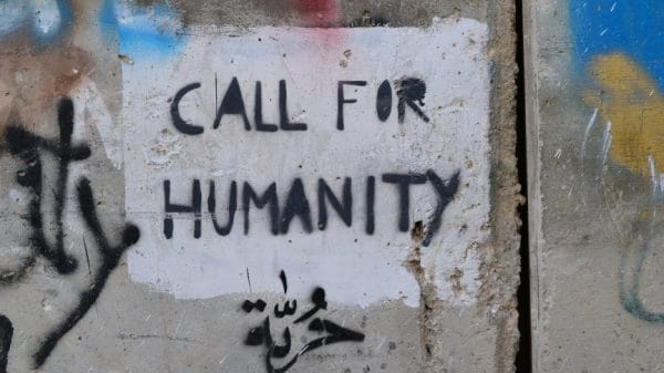 Call for Humanity written on a wall.