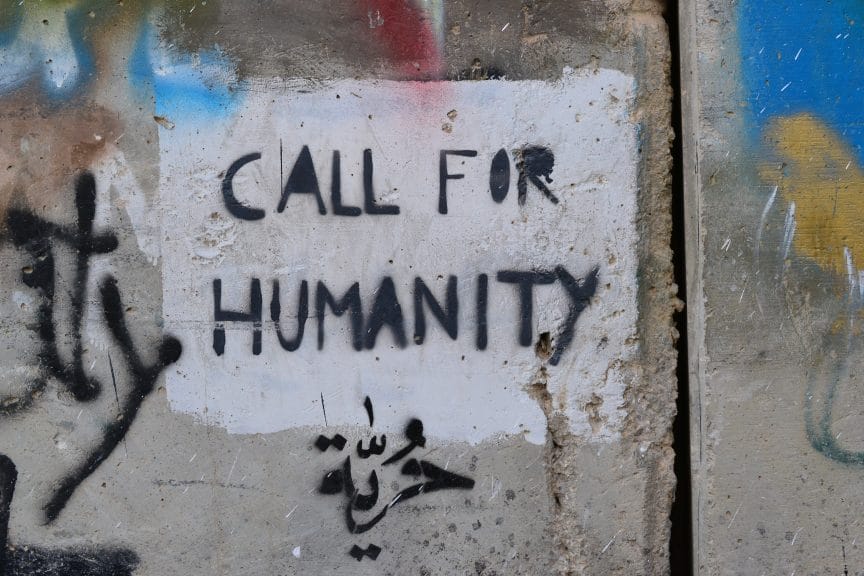 Call for Humanity written on a wall.