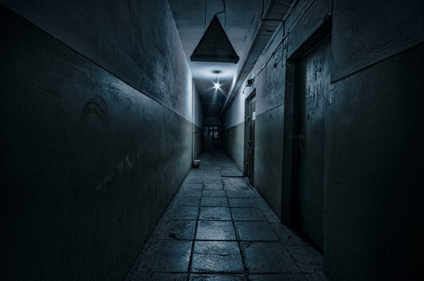 Dark corridor of abandoned building.