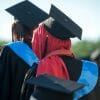 Muslim woman in red hijab graduating