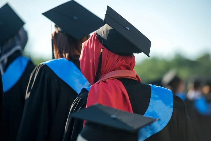 Muslim woman in red hijab graduating