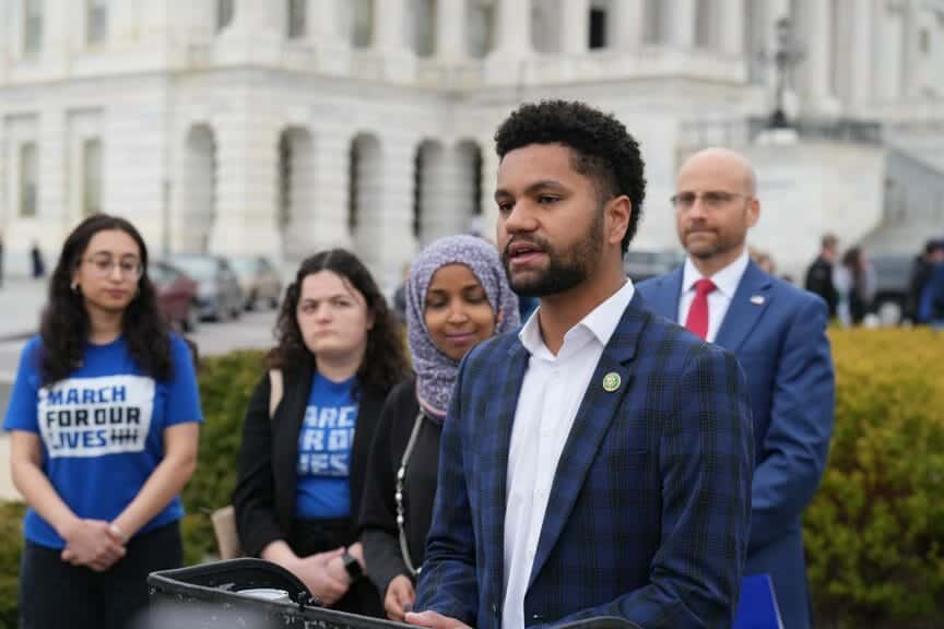 maxwell frost adressing crowd with march for our lives members behind him. Gun safety. Biden