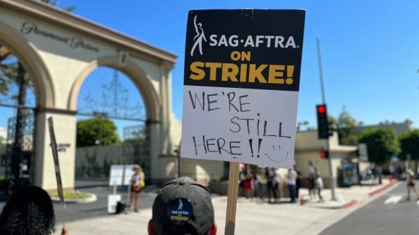 SAG-AFTRA sign saying "We're still here."