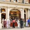 People wait outside of a Goyard store in Paris to get their hands on a luxury bag.