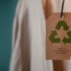 Beige clothing with recycling logo attatched to it