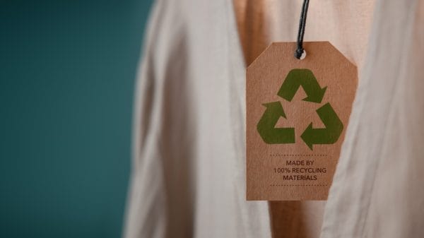 Beige clothing with recycling logo attatched to it