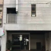 A picture of the Asahi Ryokan's minimalist exterior in Fukuoka.