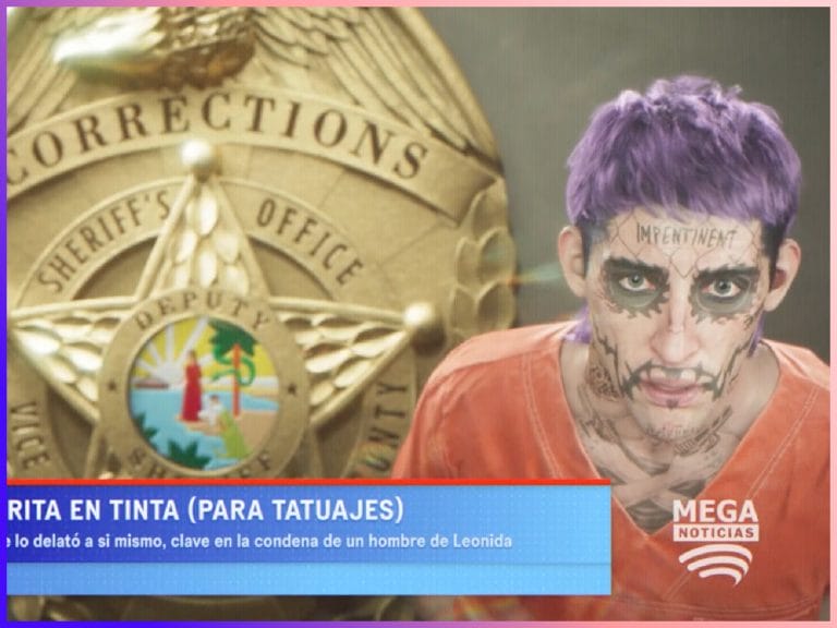 Screenshot of the arrested man with joker-like face tattoos and bright purple hair.
