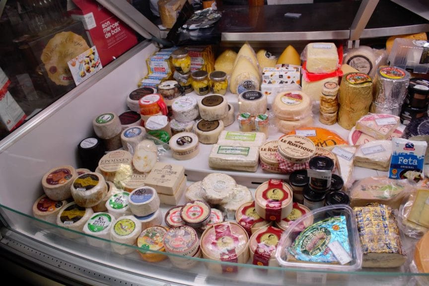 A fridge full of cheeses inside Colmado Quilez, Barcelona.