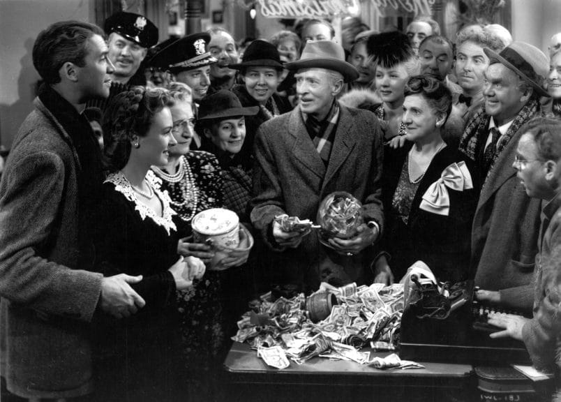 A group of characters get together at the end of It's a Wonderful Life.