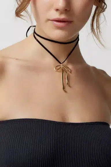 Girl Wearing Bow Necklace 