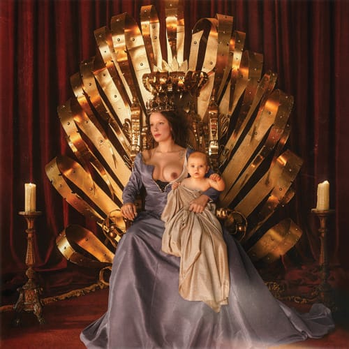 Album cover for Halsey's album 'If I Can't Have Love, I Want Power.' She sits on a golden throne with a grey dress and a baby on one knee.