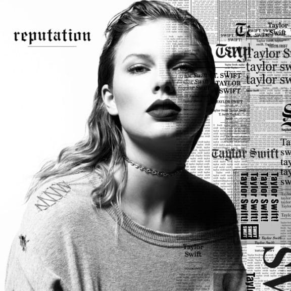Cover art for Taylor Swift's 'Reputation.' She's displayed in front of a background with various newspapers headlines about her, The entire image is in black and white.