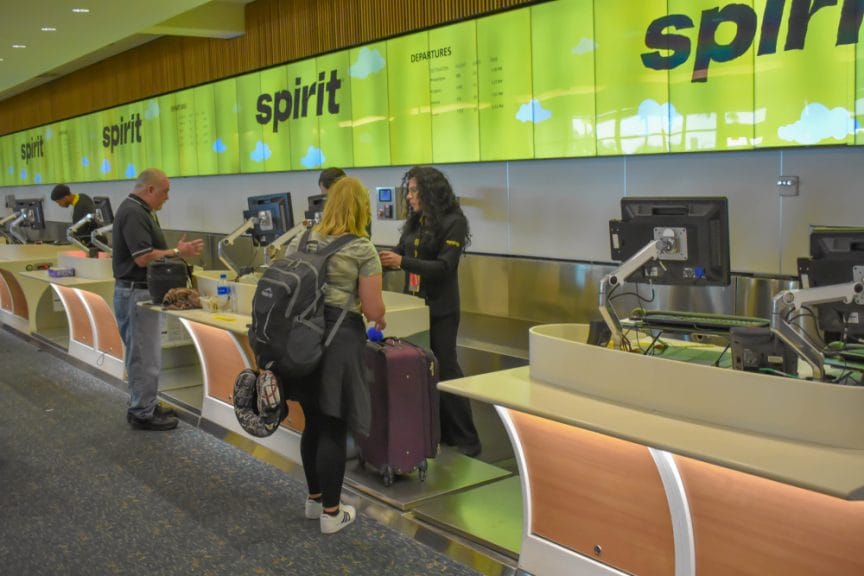Spirit Airlines check-in at Orlando International Airport. Image: VIAVAL TOURS/Shutterstock