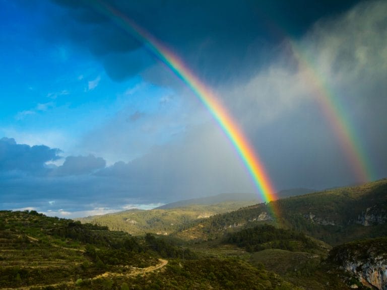 Double rainbow in the mountains