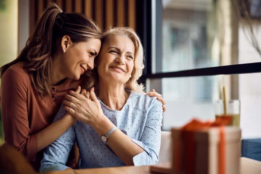 Mother and daughter hugging