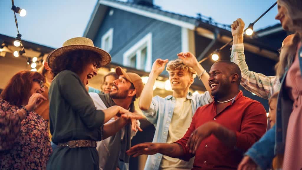 A group of people talking and having fun.