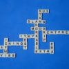 Scrabble board with slang terms such as vibe, extra, etc. Has a blue background