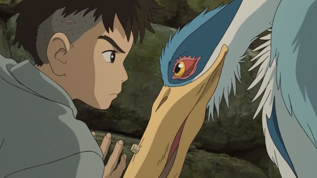 Still from 'The Boy and the Heron' of Mahito and the Heron facing one another intensely. 
