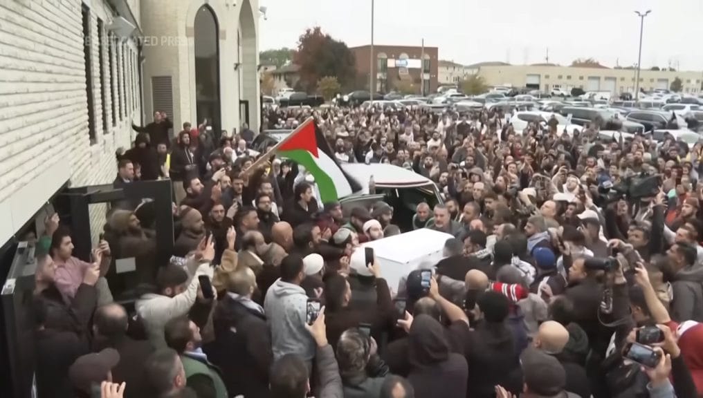 Mourners pay tribute to hate crime victim Wadea Al-Fayoume, a six-year-old boy who was murdered by his landlord.